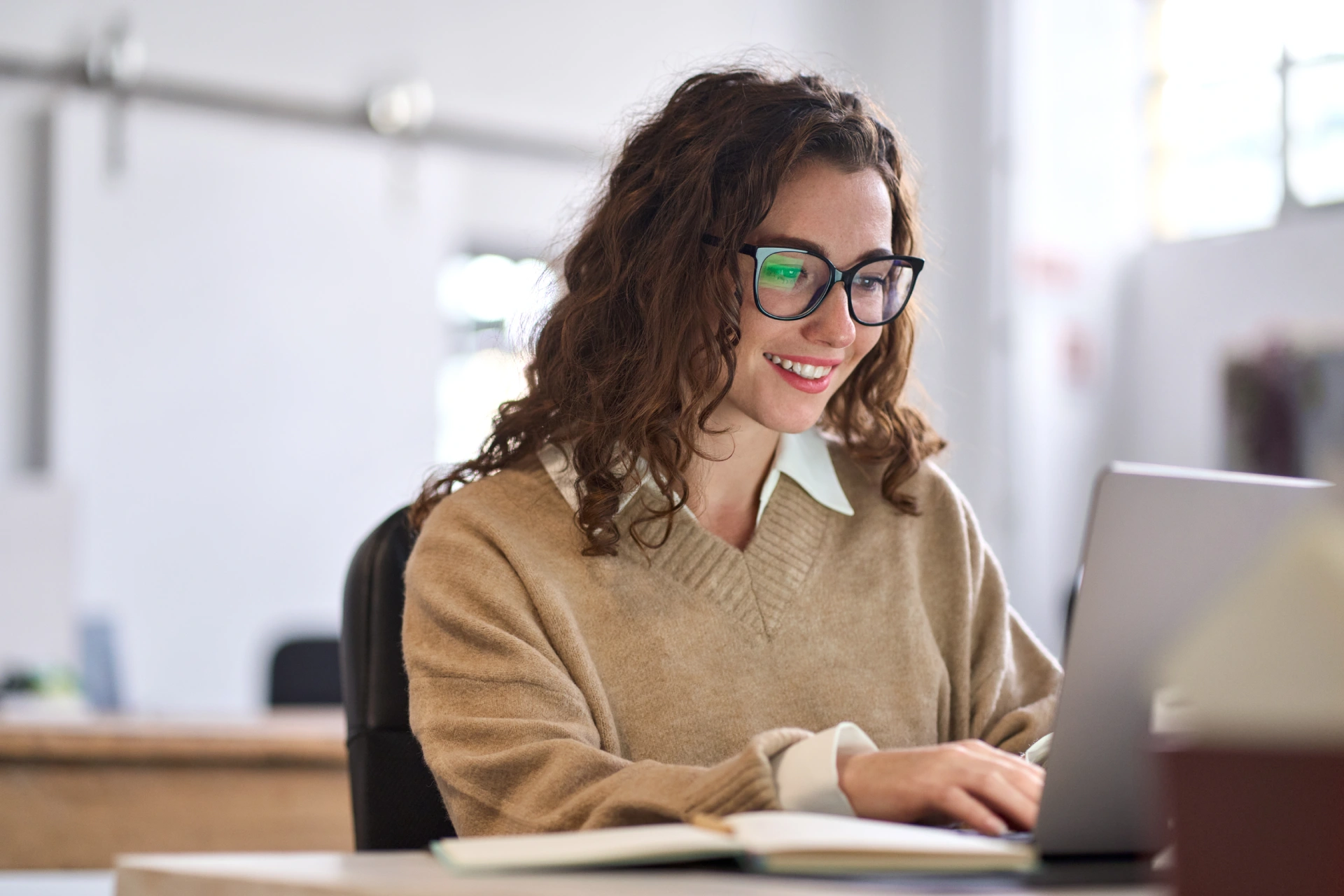 happy female working on her computer